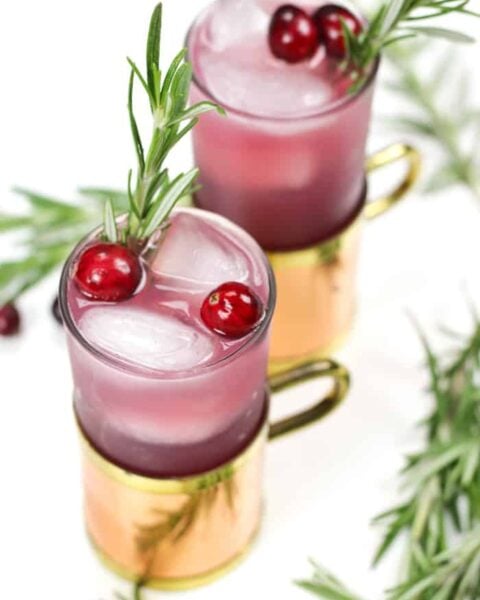 Based on the traditional Moscow Mule, the Yule Mule is a holiday cocktail featuring ginger beer and cranberry juice. Garnish it with rosemary and fresh cranberries for a cocktail that tastes just like Christmas! (via feastandwest.com)