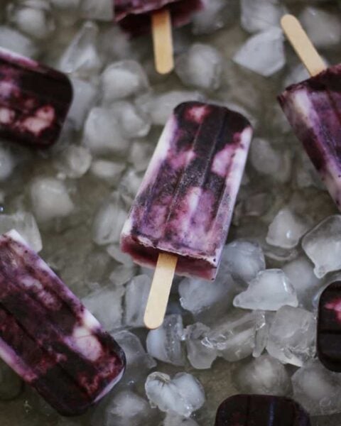 Swirled Blueberry Yogurt Popsicles are the frozen treat that's the answer to hot summer days. (via feastandwest.com)