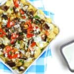 Blackened Steak + Blue Cheese Nachos are a glorious snack for game day. Steak cooked on the grill or in a skillet is served atop a bed of potato chips and blue cheese queso. (via feastandwest.com)