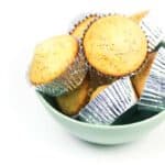 orange poppy seed muffins in a green bowl