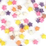 colored sugar cubes arranged on a white background