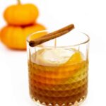 two pie pumpkins with a pumpkin spice old-fashioned