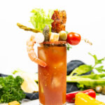 classic Bloody Mary cocktail on a bed of garnishes