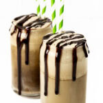 two guinness floats in beer can-shaped pint glasses