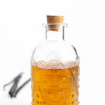 a cork in a bottle of vanilla syrup