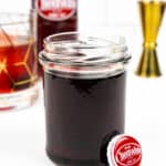a cheerwine bottle cap with a jar of cheerwine syrup