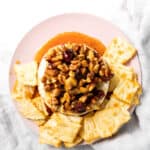 baked brie and crackers on a plate
