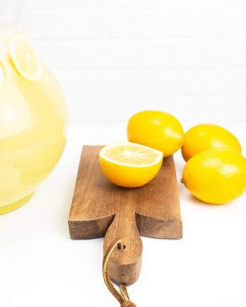 a cutting board with lemons