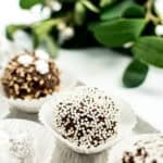 Boozy no-bake cookies with winter greenery in the background