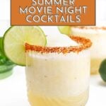 Glass of a frozen iconic cocktail with a chili-lime rim and a lime wheel garnish, placed on a white surface, with text reading "17+ Summer Movie Night Cocktails.