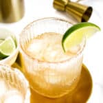 closeup of a lime garnish on a cadillac margarita.