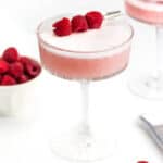 two pink cocktails on a white backdrop.