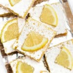 Lemon bars on a silver tray.