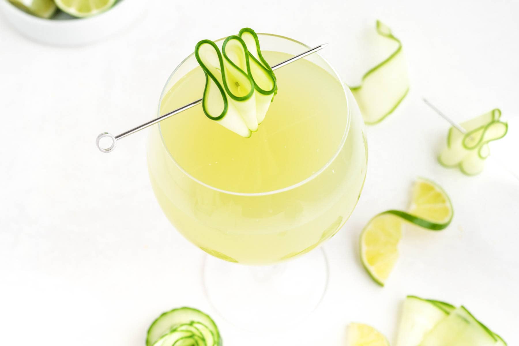 Light green cucumber agua fresca served in clear glass.