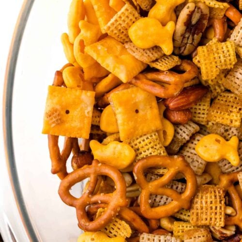 A bowl full of cheesy snack mix.