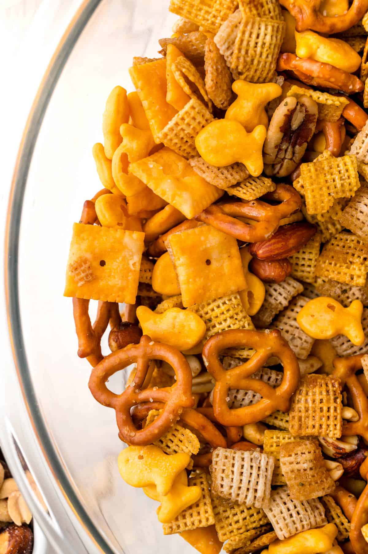 A bowl full of cheesy snack mix.