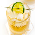 A refreshing cocktail featuring a lime garnish served over ice in a glass and made with the zesty combination of Jack and Ginger Ale.