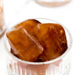 Caramel ice cubes in a glass bowl.