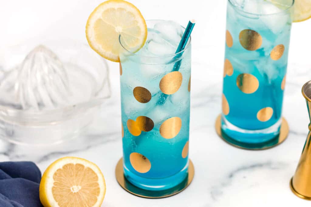 Bold, citrusy cocktail with a vibrant blue hue.