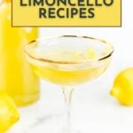 A glass of limoncello with a lemon twist garnish sits before a bottle and whole lemons. Text above reads “10+ Limoncello Cocktails & Recipes.”.