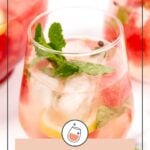 A glass of citrus watermelon sangria with ice, mint leaves, and lemon slices, surrounded by more glasses of the same refreshing drink.
