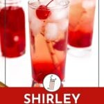 A tall glass of Shirley Temple drink with ice and a cherry garnish, placed in front of another glass with a red beverage.