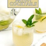 Two glasses of a light-colored cocktail with ice, lemon slices, and mint garnish sit next to a glass pitcher and a cork on a white surface. Text reads "25+ Batch Cocktails.