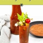 A glass of Bloody Mary garnished with celery, tomato, pickles, and olives sits in front of a bottle of Bloody Mary mix and a plate of seasoning. Text reads, "Perfect for parties: bloody mary bar.