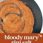 A black plate with a swirl of red-orange seasoning labeled "bloody mary rim salt: peppery, salty, aromatic.