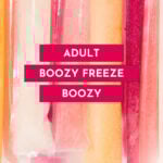 Colorful boozy freeze pops in plastic sleeves are arranged vertically with text overlay reading "Adult Boozy Freeze Boozy" and website "feastandwest.com" at the bottom—perfect for fans of frozen cocktails.