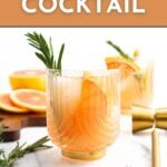 A glass of grapefruit cocktail garnished with a grapefruit slice and rosemary, with a gold cocktail shaker and sliced grapefruit in the background. Text reads “Grapefruit Cocktail.”.