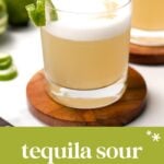 A tequila sour cocktail with a frothy top, garnished with a lime twist, sits on a wooden coaster. Text below reads "tequila sour frothy citrus cocktail.