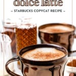 A brown mug of cinnamon dolce latte with frothy milk sits on a white surface, surrounded by cinnamon sticks, a glass container, and a jar of brown sugar. Text reads "cinnamon dolce latte." Enjoy this cozy cinnamon dolce latte moment.