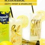 Two glasses of limoncello lemonade with lemon slices and straws are placed beside a limoncello bottle, a jigger, and a whole lemon.