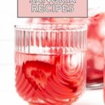 A glass of pink sangria with ice and strawberry slices; text above reads "20 Sangria Recipes"—discover your new favorite from these refreshing sangria recipes.