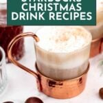 A glass mug of a frothy holiday drink in a copper holder sits on a white surface next to chestnuts, with text reading "11 Starbucks Christmas Drink Recipes.