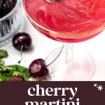 A cherry martini garnished with two cherries on a cocktail pick, next to fresh cherries and a glass bowl, with text reading “cherry martini easy summer drink.”.
