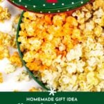 Open green tin filled with yellow and white popcorn, some popcorn scattered outside; text below reads "homemade gift idea: diy christmas popcorn tins.