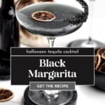 A black margarita cocktail garnished with a dried citrus slice and black salt rim, with a bottle, skull decor, and dried citrus on the table. Text overlay reads "Black Margarita.