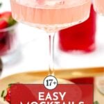 A pink mocktail in a coupe glass on a gold tray with strawberries; overlay text reads "17+ Easy Mocktails.