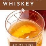 A glass of Non-Alcoholic Whiskey with an orange peel garnish, shown from above, features text promoting a delicious homemade recipe.