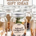 Several mason jars filled with various ingredients, one labeled "infused cocktail kit rosemary fig," offering creative mason jar gift ideas.