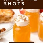 Three small mason jars filled with orange apple pie shots topped with whipped cream and cinnamon, next to a slice of pie and cinnamon sticks. Text reads, "How to make apple pie shots.