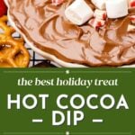 A bowl of hot cocoa dip topped with marshmallows and crushed peppermint, surrounded by pretzels and strawberries, with text reading "the best holiday treat HOT COCOA DIP.