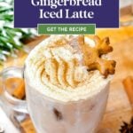 A glass mug of iced latte topped with whipped cream, cinnamon, and a gingerbread cookie, with a "Gingerbread Iced Latte" recipe banner overlay.