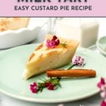 A slice of cinnamon milk tart on a green plate, garnished with flowers and a cinnamon stick, with a pie dish and milk in the background. Text reads: "Cinnamon Milk Tart Easy Custard Pie Recipe.