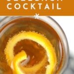 Overhead view of a Seelbach cocktail garnished with an orange twist, with text promoting a recipe for the drink.