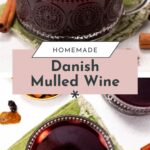 Two clear glass cups filled with dark red mulled wine, each garnished with a cinnamon stick, are set on a green napkin with loose cinnamon sticks and raisins nearby.