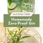 A jar of homemade alcohol-free gin with herbs and cucumber slices, and two glasses of clear drinks garnished with rosemary. Text reads: "Homemade Zero-Proof Gin.