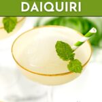 A frozen lemon daiquiri in a gold-rimmed glass, garnished with mint and a green striped straw. Text reads "Frozen Lemon Daiquiri," "Get the Recipe," and "feastandwest.com.